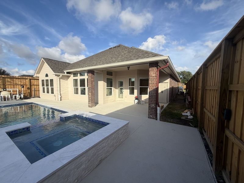 New Portland, TX house with a pool patio and seamless gutters