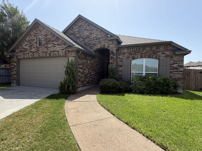 Portland, TX brick home after a J Seamless Gutters install