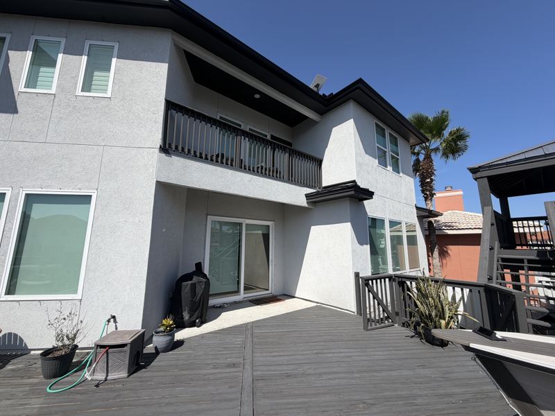 Modern white two-story, black gutters — Corpus Christi, TX