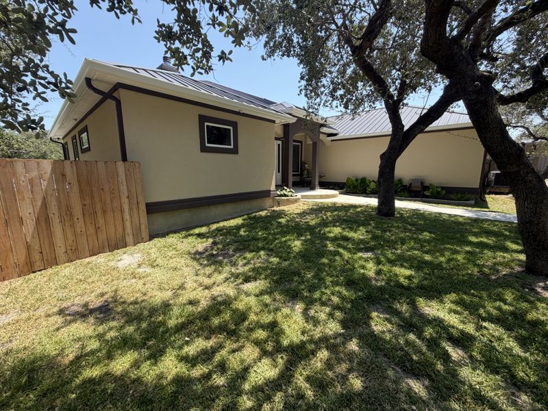 Tan home under the oaks, with pool — Fulton, TX
