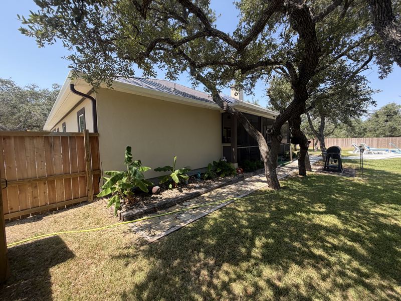 Tan home under the oaks, with pool — Fulton, TX