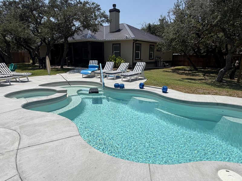 Tan home under the oaks, with pool — Fulton, TX