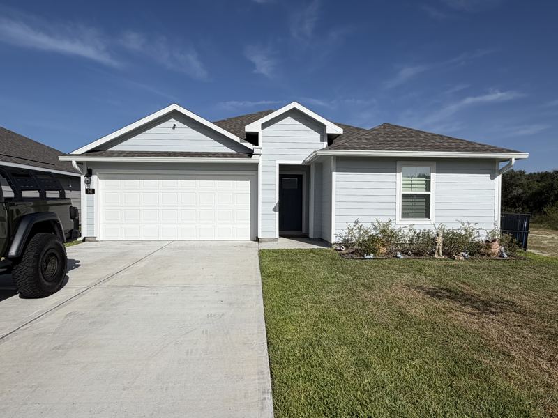 Light gray home, white gutters — Rockport, TX