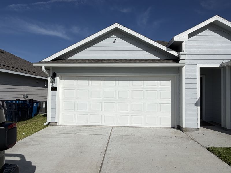 Light gray home, white gutters — Rockport, TX
