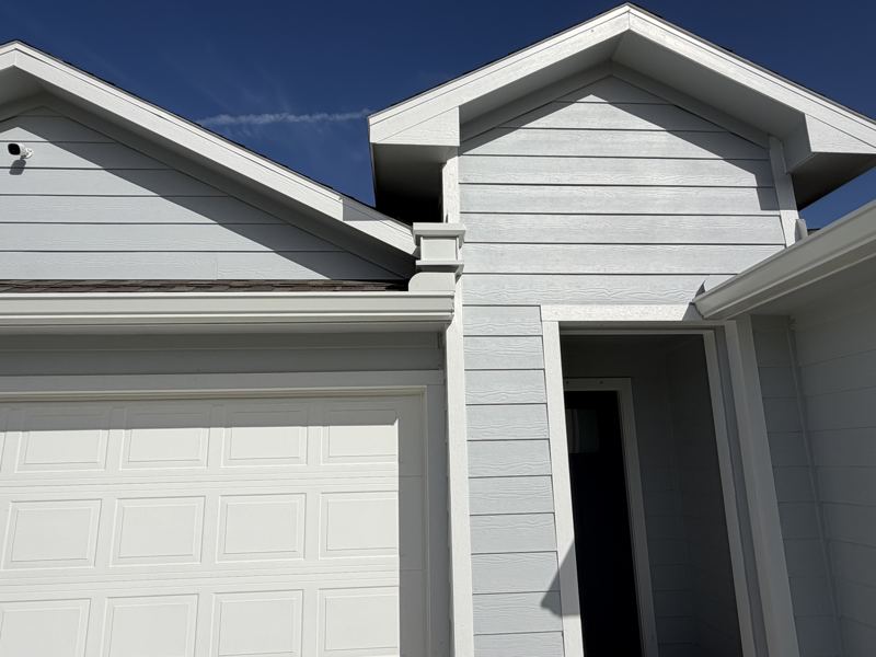 Light gray home, white gutters — Rockport, TX