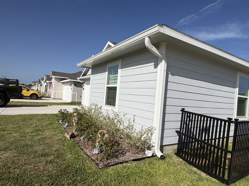 Light gray home, white gutters — Rockport, TX