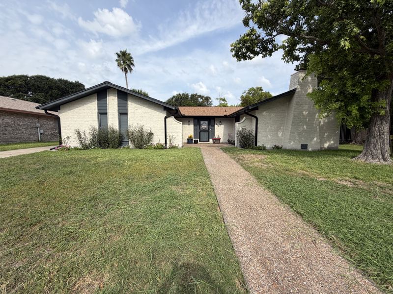 White brick home, black gutters — Portland, TX