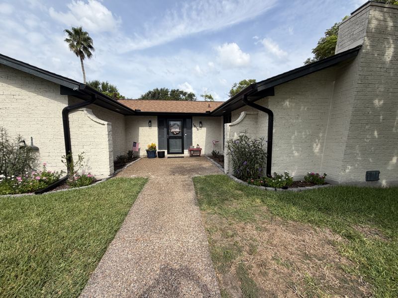 White brick home, black gutters — Portland, TX