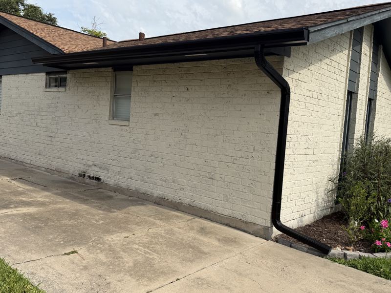 White brick home, black gutters — Portland, TX