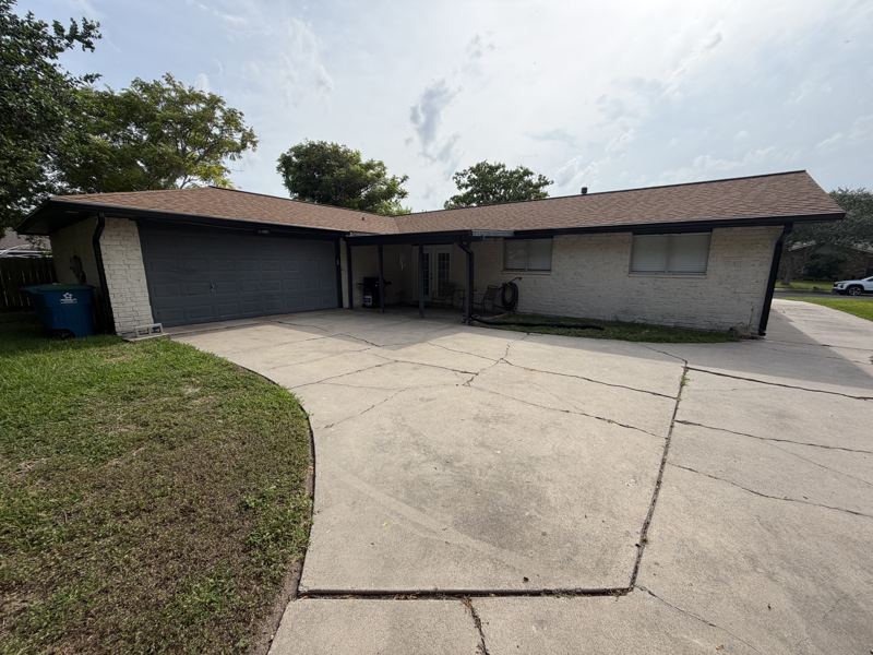 White brick home, black gutters — Portland, TX