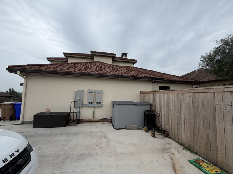 Tan stucco and stone home — Corpus Christi, TX