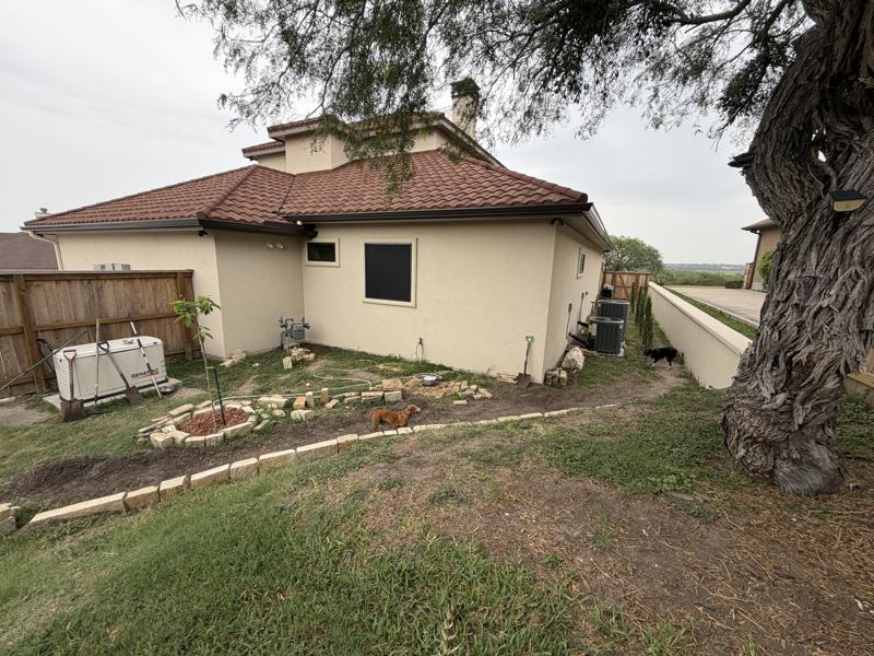 Tan stucco and stone home — Corpus Christi, TX