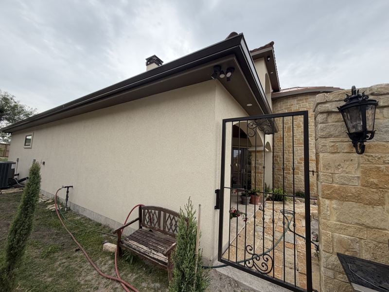 Tan stucco and stone home — Corpus Christi, TX