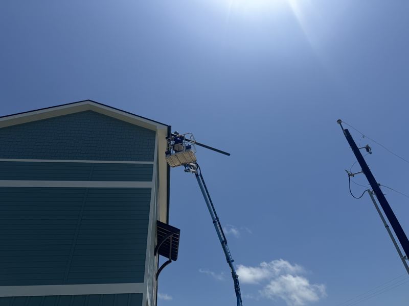 Three-story raised coastal home — Fulton, TX