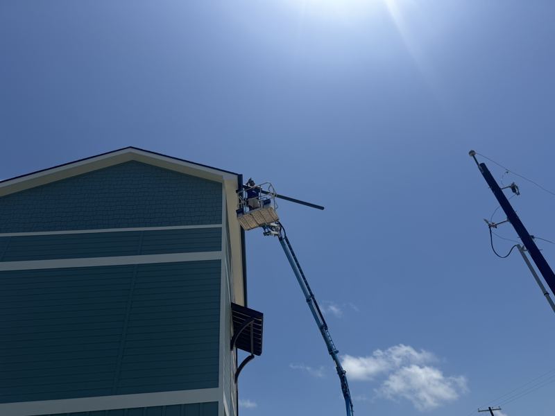 Three-story raised coastal home — Fulton, TX