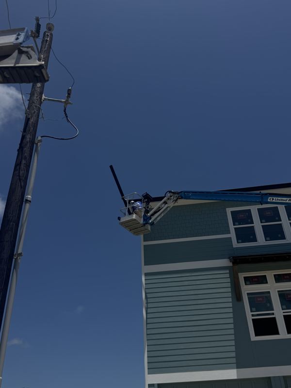 Three-story raised coastal home — Fulton, TX