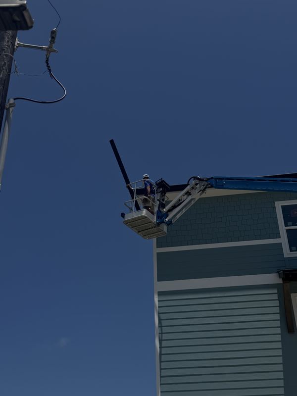 Three-story raised coastal home — Fulton, TX