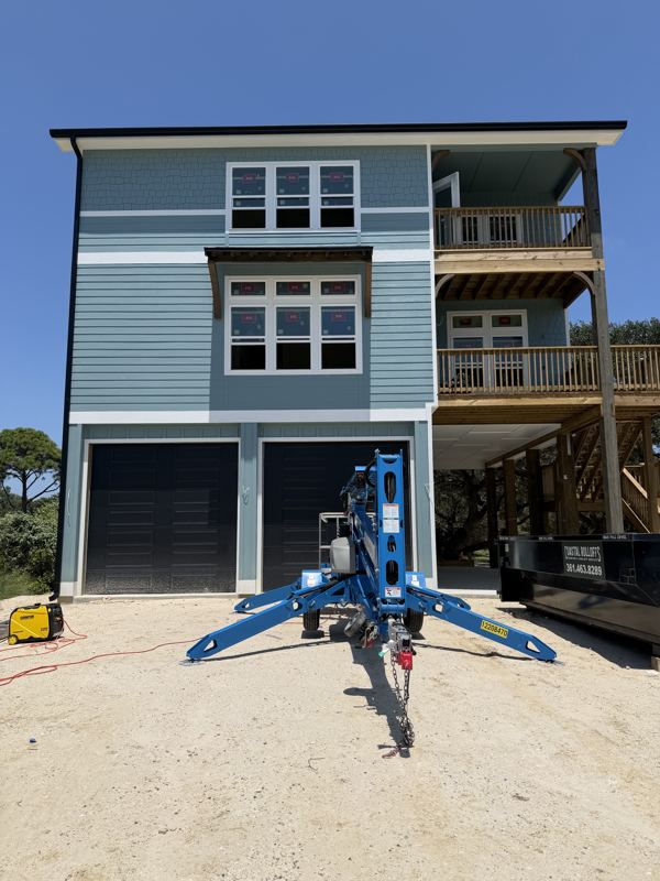 Three-story raised coastal home — Fulton, TX