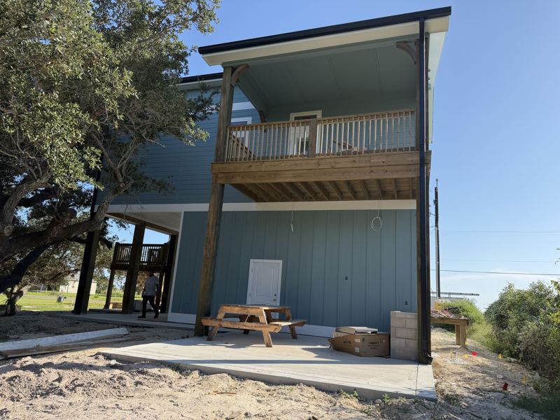 Three-story raised coastal home — Fulton, TX