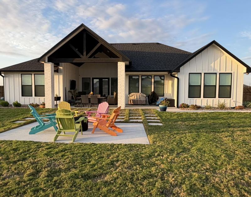 White brick and board-and-batten home, black gutters — Corpus Christi Area, Oct 2026