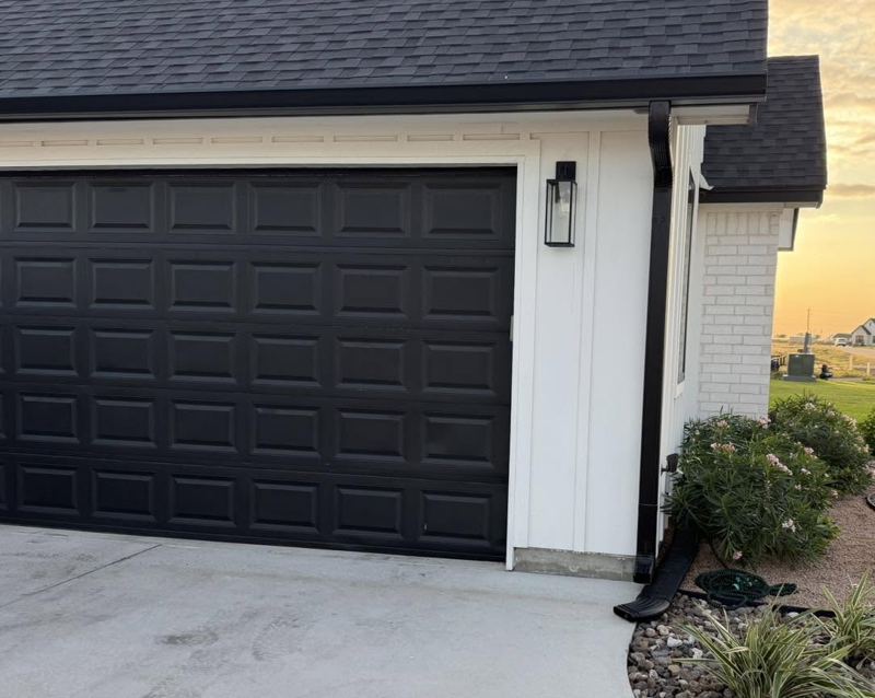 White brick and board-and-batten home, black gutters — Corpus Christi Area, Oct 2026